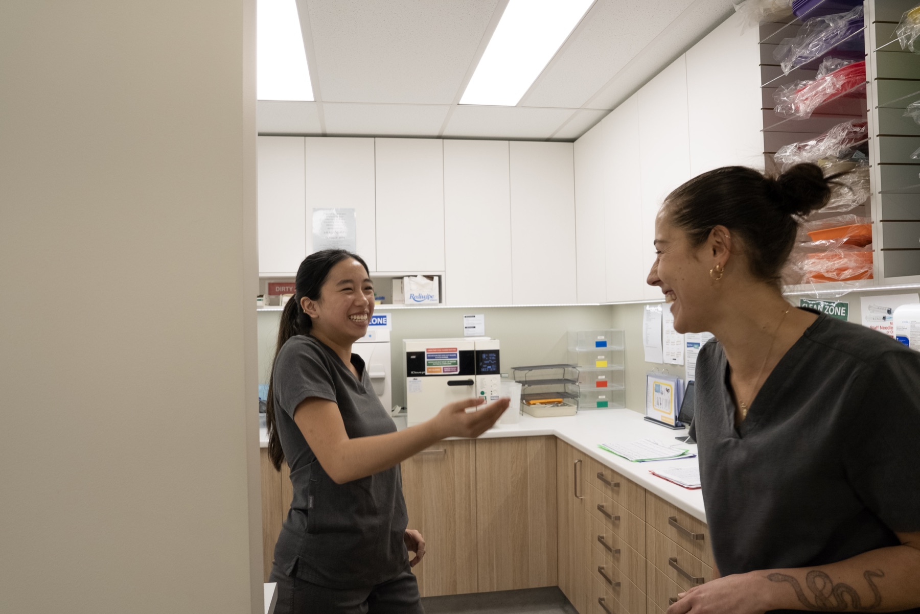 Newtown Elite Dental clinicians collaborating behind the scenes