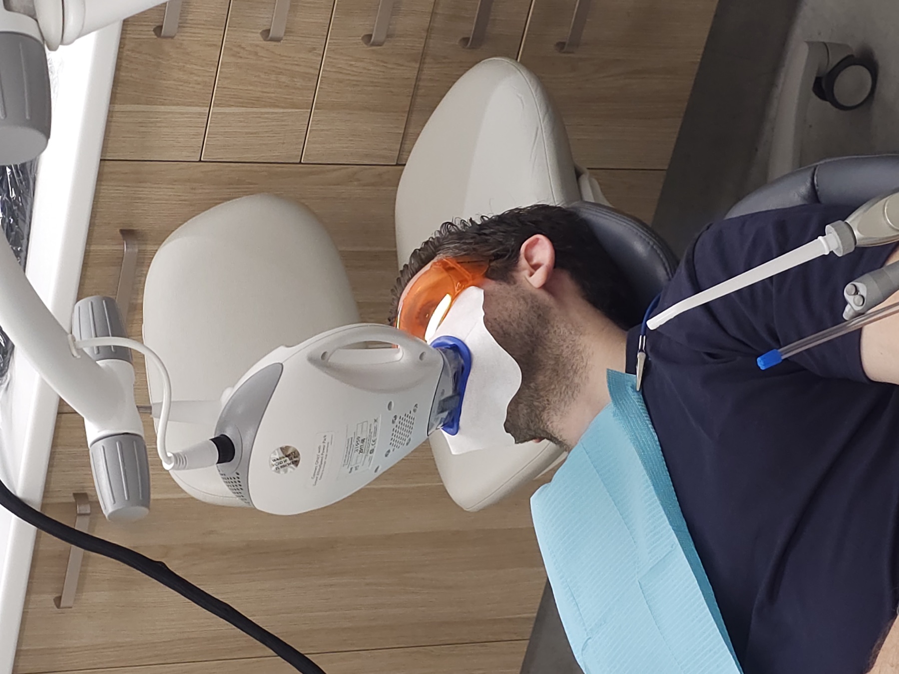 A patient receiving Philips Zoom teeth whitening at Newtown Elite Dental