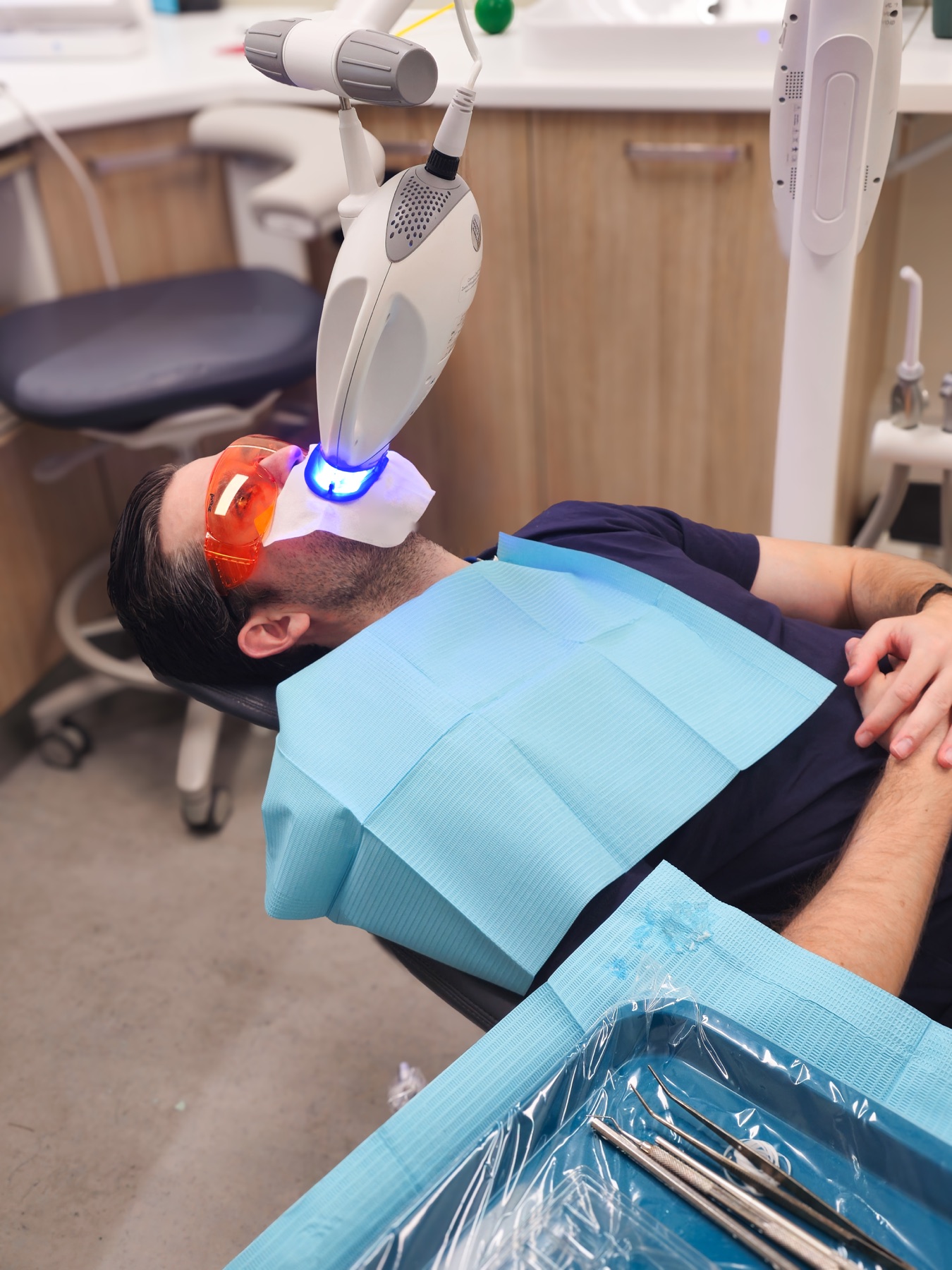 Clinician applying whitening gel during a Philips Zoom treatment